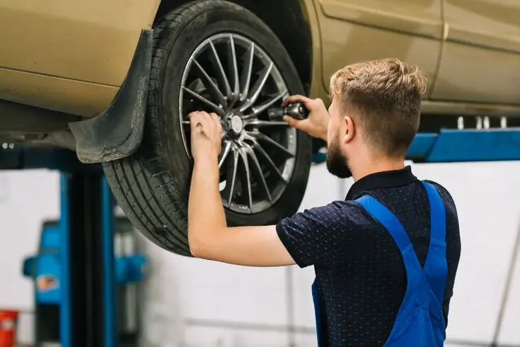 Alloy wheel repair specialists in Aberdeen working on damaged wheel
