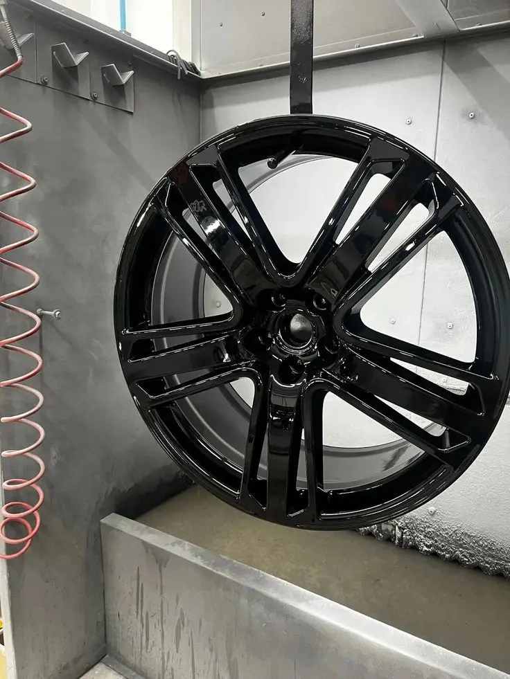 Applying protective lacquer on diamond cut alloy wheel