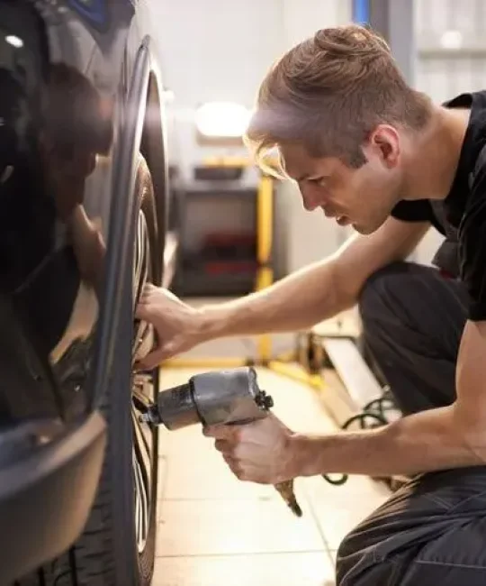 Alloy wheel repair specialists in Aberdeen working on damaged wheel